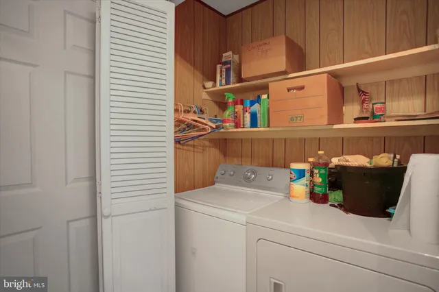 a kitchen with a stove and a white refrigerator