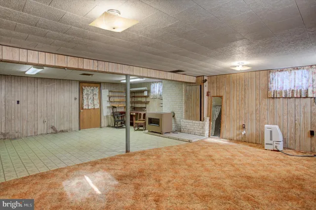 a view of a house with pool yard and sitting area