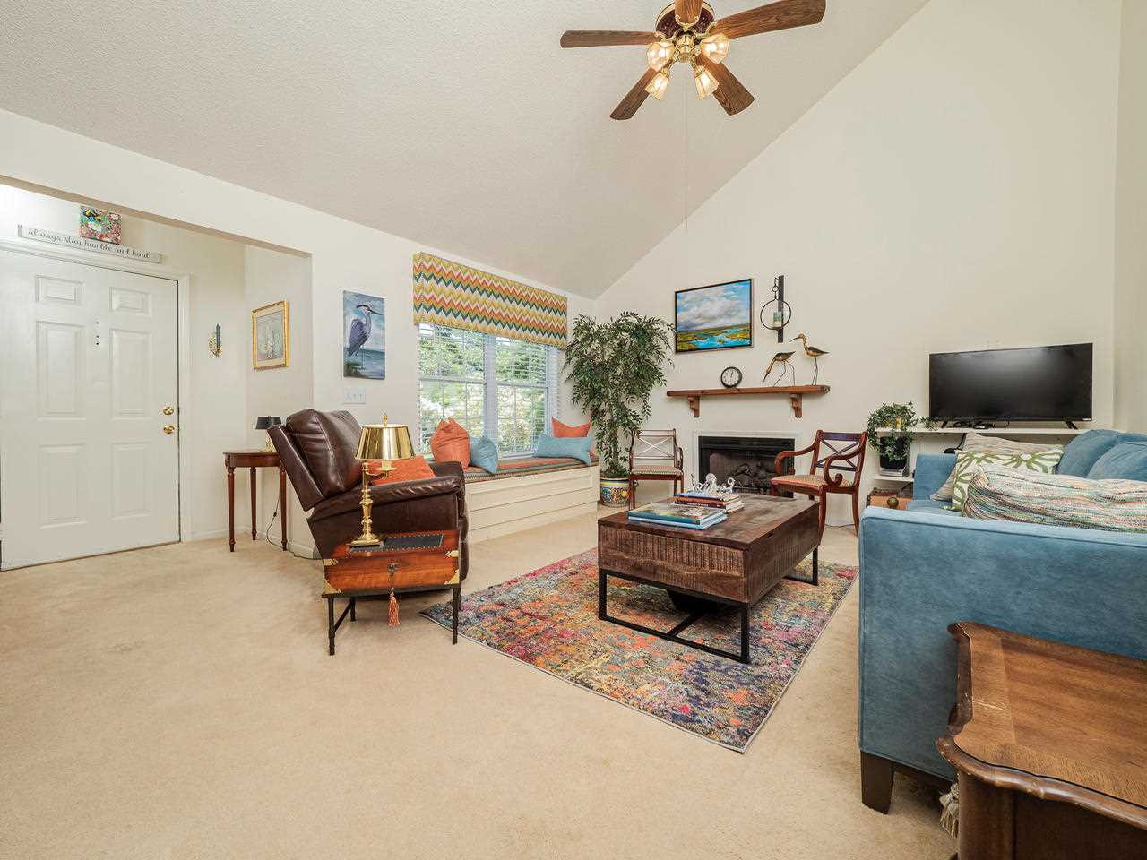 1064 Mills Street Raleigh, NC 27608 - Photo 3 of 24 Living Room with Vaulted Ceiling