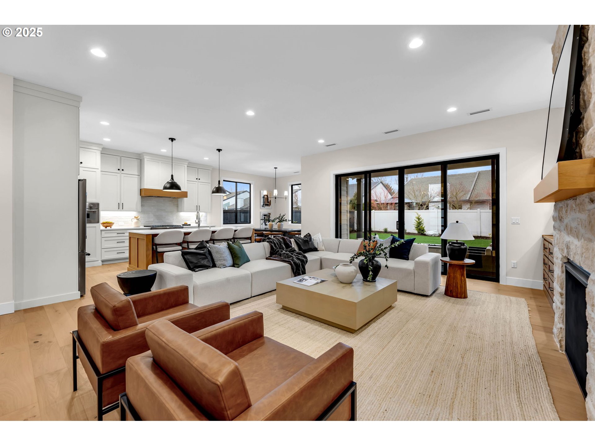 17716 Northeast 25th Avenue Ridgefield, WA 98642 - Photo 16 of 48 a living room with fireplace furniture and a large window