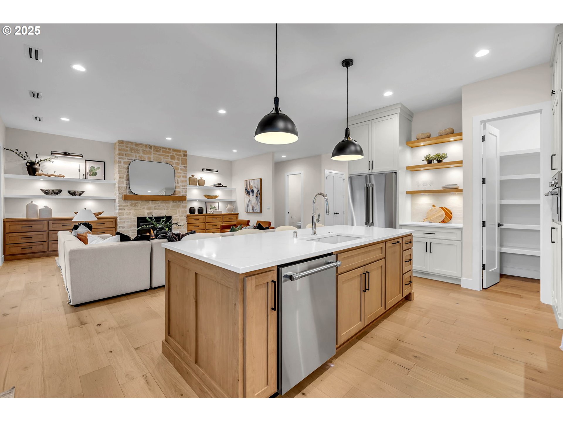 17716 Northeast 25th Avenue Ridgefield, WA 98642 - Photo 20 of 48 a kitchen with stainless steel appliances kitchen island granite countertop a sink and a refrigerator
