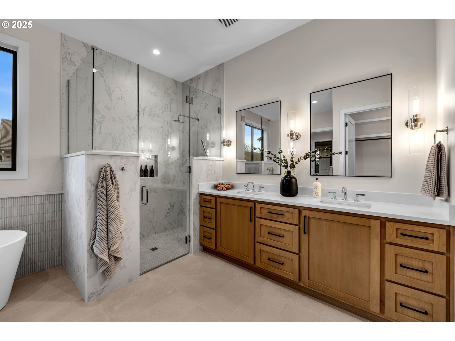 17716 Northeast 25th Avenue Ridgefield, WA 98642 - Photo 30 of 48 a spacious bathroom with a double vanity sink and a mirror