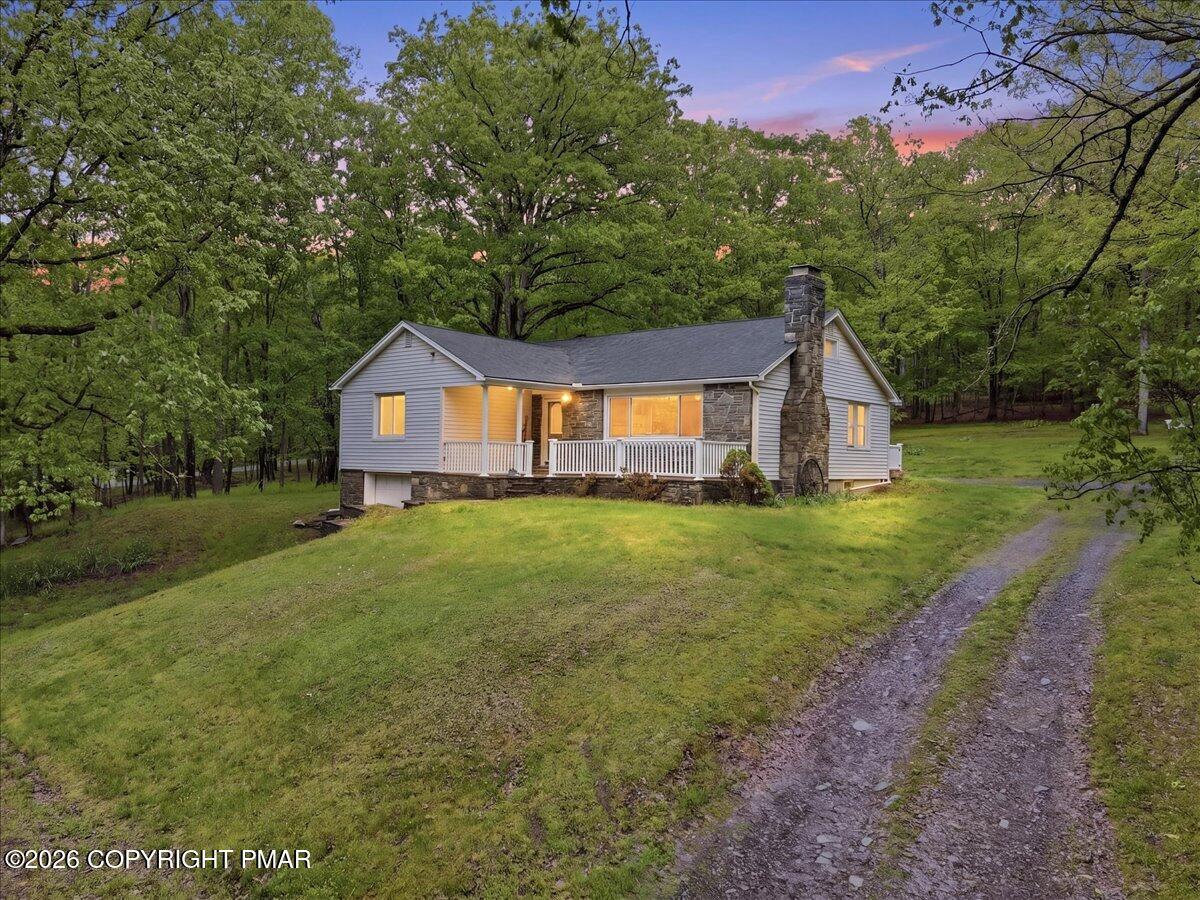 232 Garrity Road Hawley, PA 18428 - Photo 6 of 57 a house view with a garden space