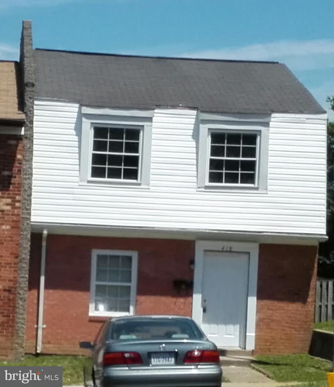 a car parked in front of a house