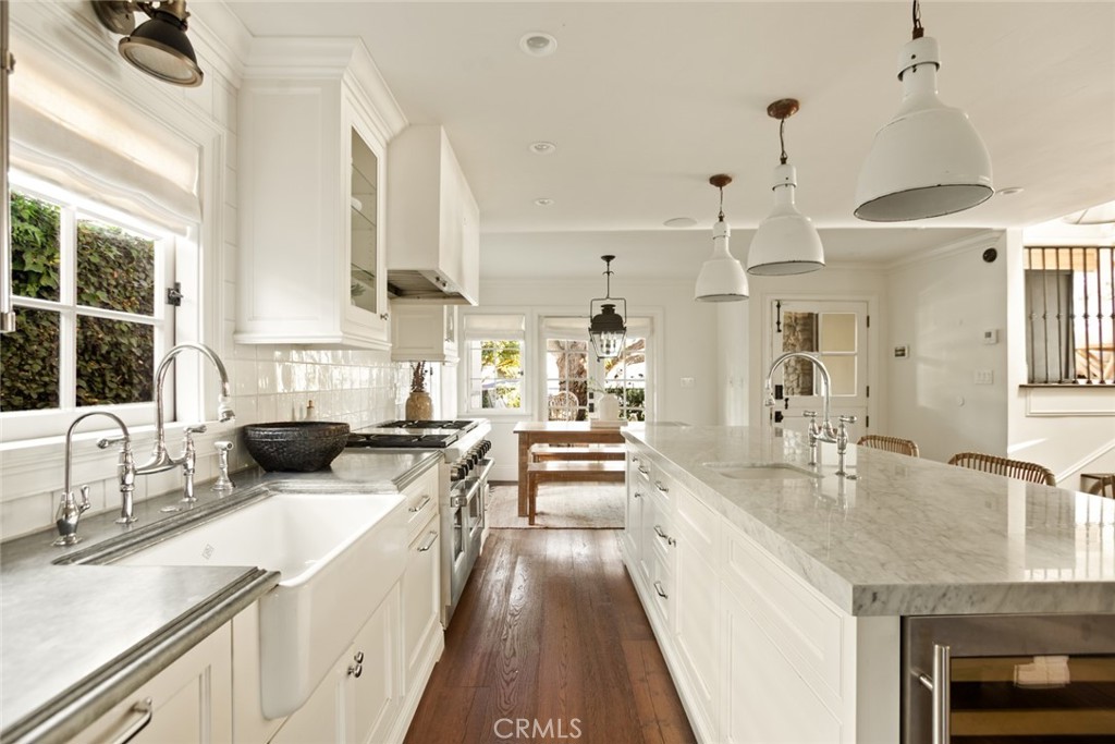 326 Ruby Street Laguna Beach, CA 92651 - Photo 16 of 71 a kitchen with stainless steel appliances a sink a stove and a wooden cabinets