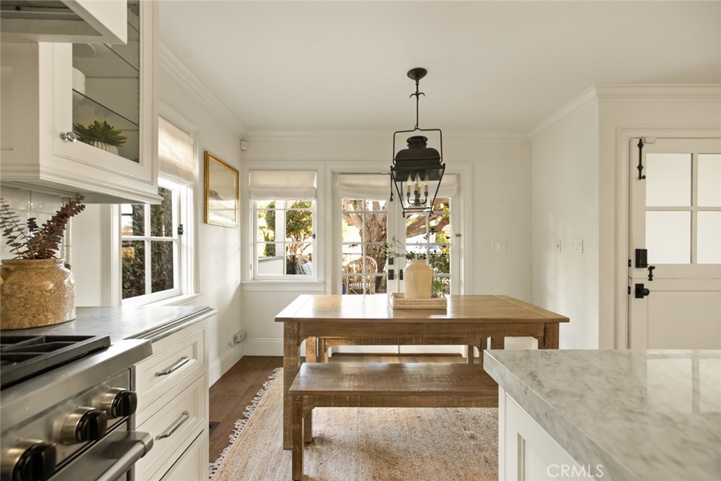326 Ruby Street Laguna Beach, CA 92651 - Photo 18 of 71 a kitchen with stainless steel appliances granite countertop a stove and white cabinets