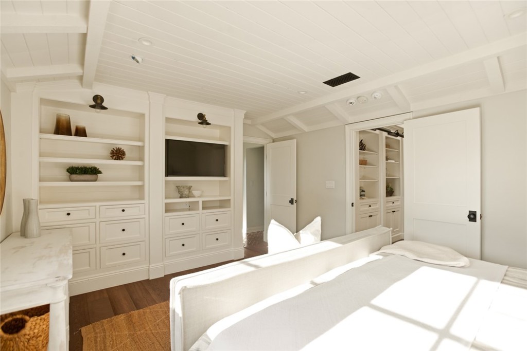 326 Ruby Street Laguna Beach, CA 92651 - Photo 30 of 71 a bedroom with a bed and a flat tv screen in it