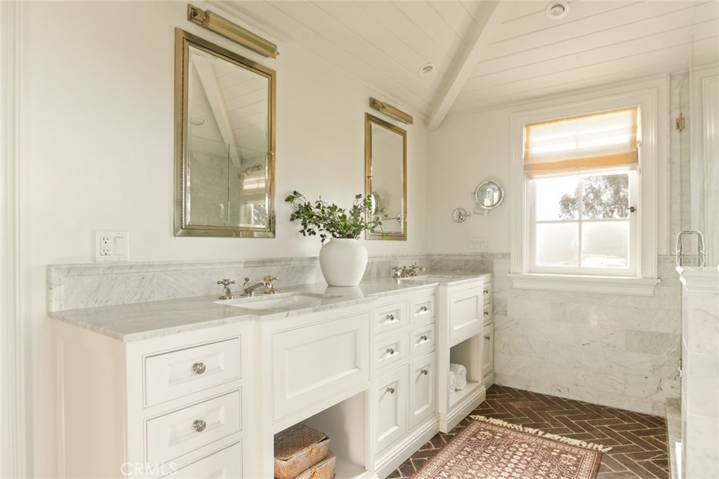 326 Ruby Street Laguna Beach, CA 92651 - Photo 34 of 71 a bathroom with double vanity sink a mirror and a shower