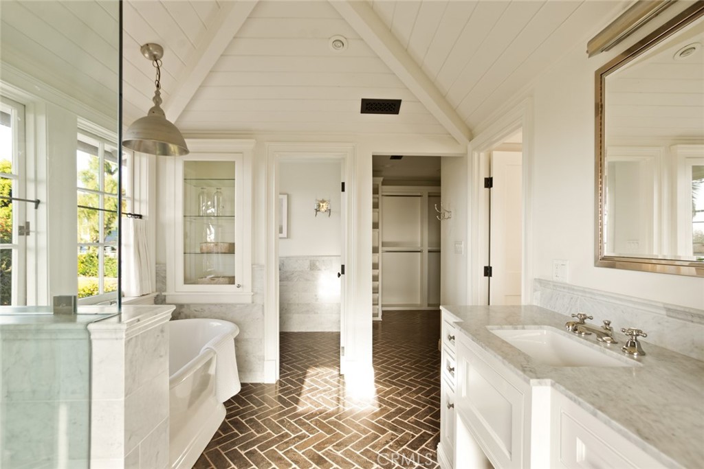 326 Ruby Street Laguna Beach, CA 92651 - Photo 37 of 71 a spacious bathroom with a double vanity sink a mirror and a shower