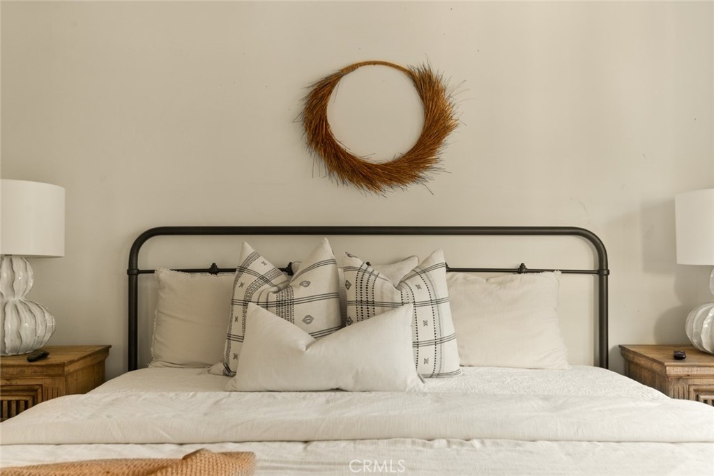 326 Ruby Street Laguna Beach, CA 92651 - Photo 52 of 71 a bedroom with a bed and a mirror