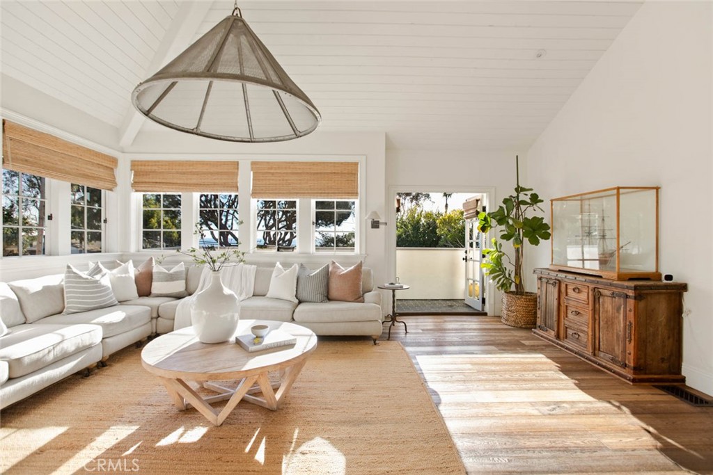 326 Ruby Street Laguna Beach, CA 92651 - Photo 6 of 71 a living room with furniture a table and a chandelier