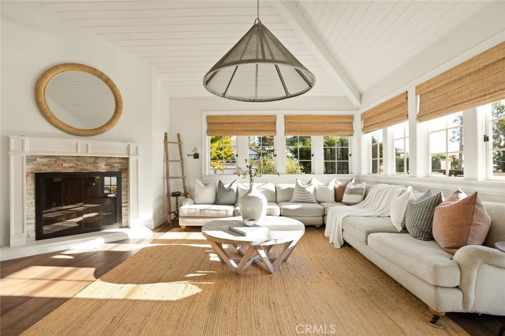 326 Ruby Street Laguna Beach, CA 92651 - Photo 8 of 71 a living room with furniture a fireplace and a large window