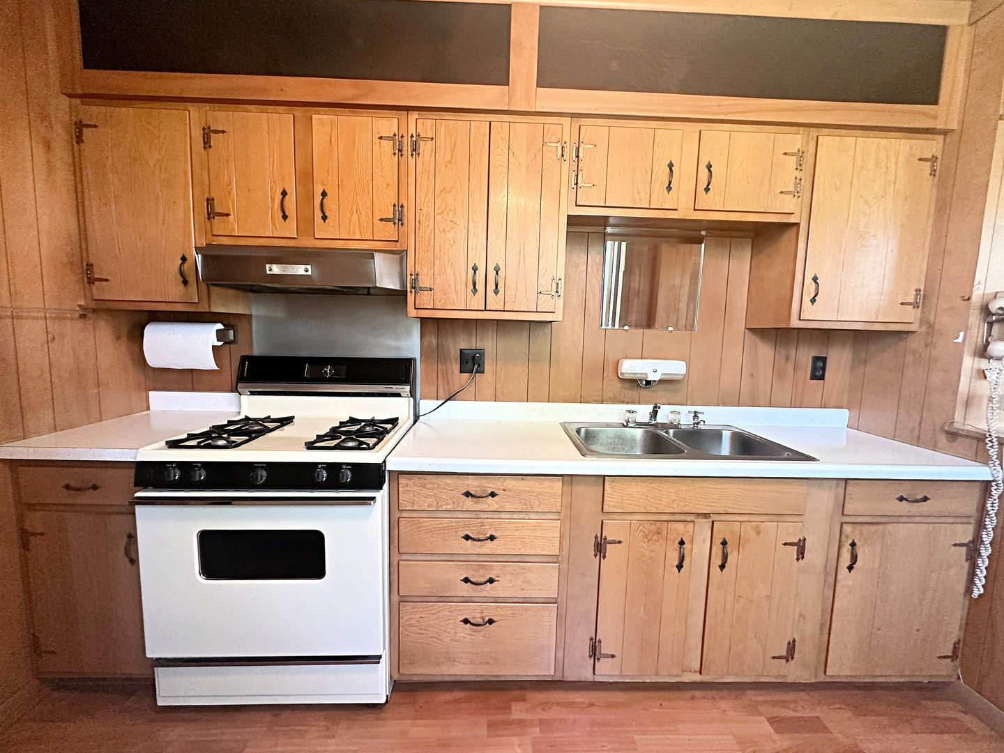 505 Morgan Street Long Point, IL 61333 - Photo 12 of 36 a kitchen with granite countertop a stove a sink and a microwave