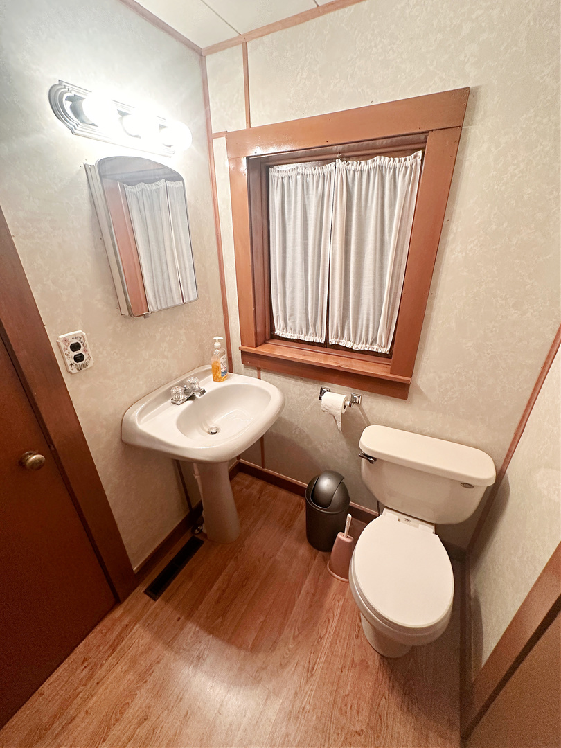 505 Morgan Street Long Point, IL 61333 - Photo 24 of 36 a bathroom with a sink a toilet and mirror