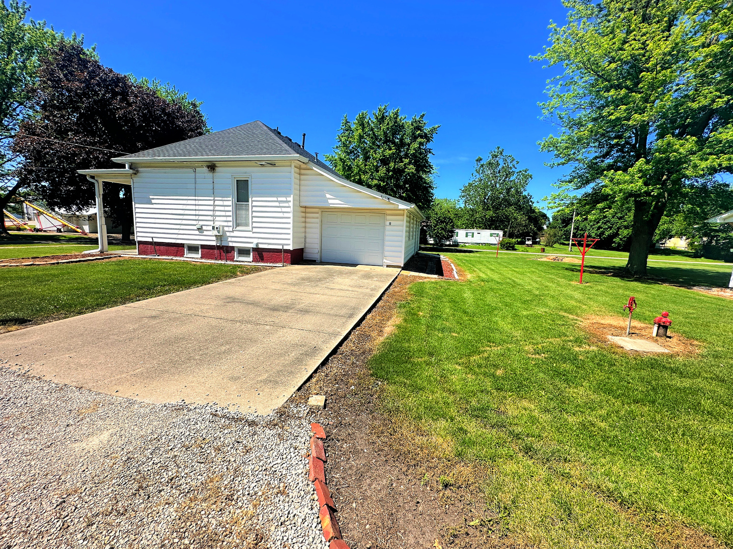 505 Morgan Street Long Point, IL 61333 - Photo 4 of 36 a front view of a house with yard and green space