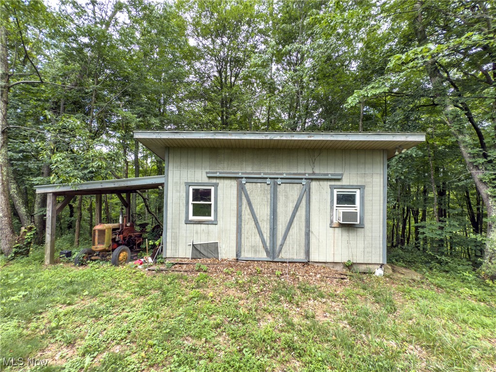 59900 Ramsey Ridge Road Jacobsburg, OH 43933 - Photo 22 of 35 View of shed with cooling unit