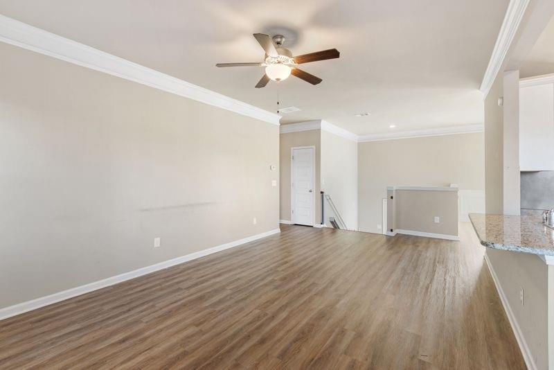 760 McCart Road Lawrenceville, GA 30045 - Photo 16 of 40 wooden floor in an empty room with a window