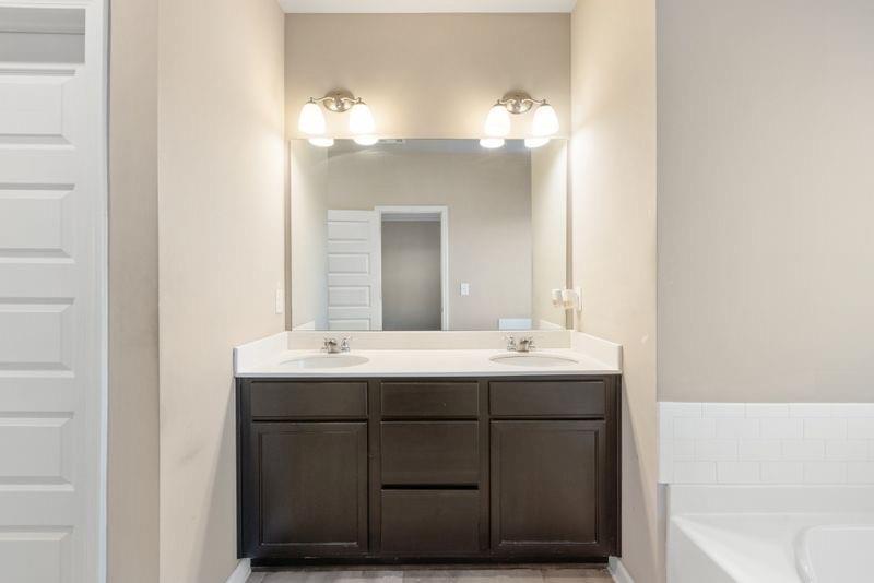 760 McCart Road Lawrenceville, GA 30045 - Photo 23 of 40 a bathroom with a sink and a mirror