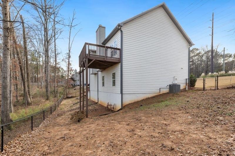 760 McCart Road Lawrenceville, GA 30045 - Photo 39 of 40 a view of a house with a backyard