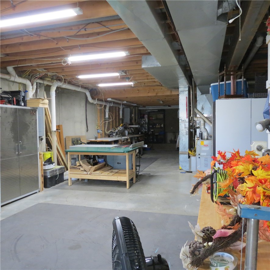 10160 Lochard Road Sidney, OH 45365 - Photo 33 of 41 This spacious utility basement offers ample room for various activities.