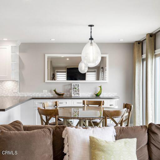 3241 Harbor Boulevard Oxnard, CA 93035 - Photo 12 of 32 a living room with furniture and a chandelier