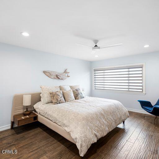 3241 Harbor Boulevard Oxnard, CA 93035 - Photo 20 of 32 a bedroom with a bed and wooden floor