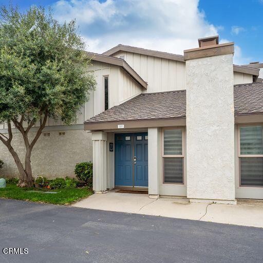 3241 Harbor Boulevard Oxnard, CA 93035 - Photo 2 of 32 a front view of a house with a yard and garage