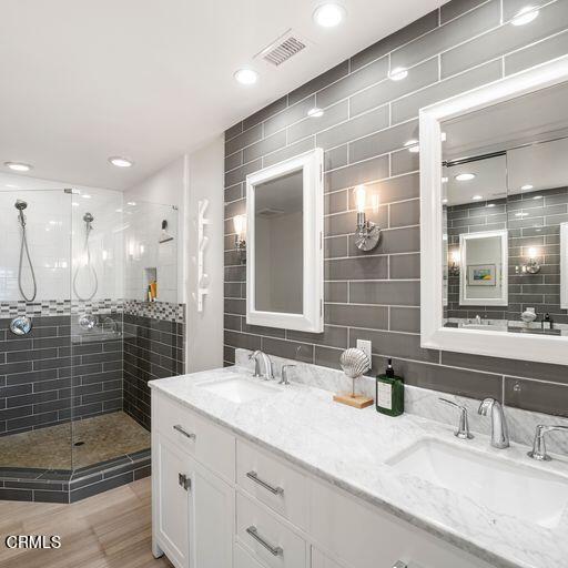 3241 Harbor Boulevard Oxnard, CA 93035 - Photo 22 of 32 a bathroom with a sink double vanity and shower