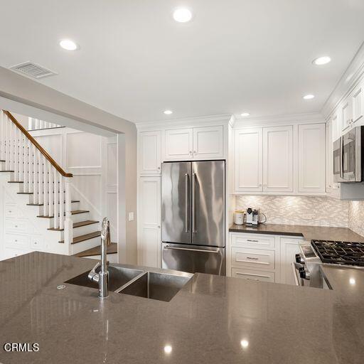 3241 Harbor Boulevard Oxnard, CA 93035 - Photo 10 of 32 a kitchen with granite countertop a refrigerator and a sink