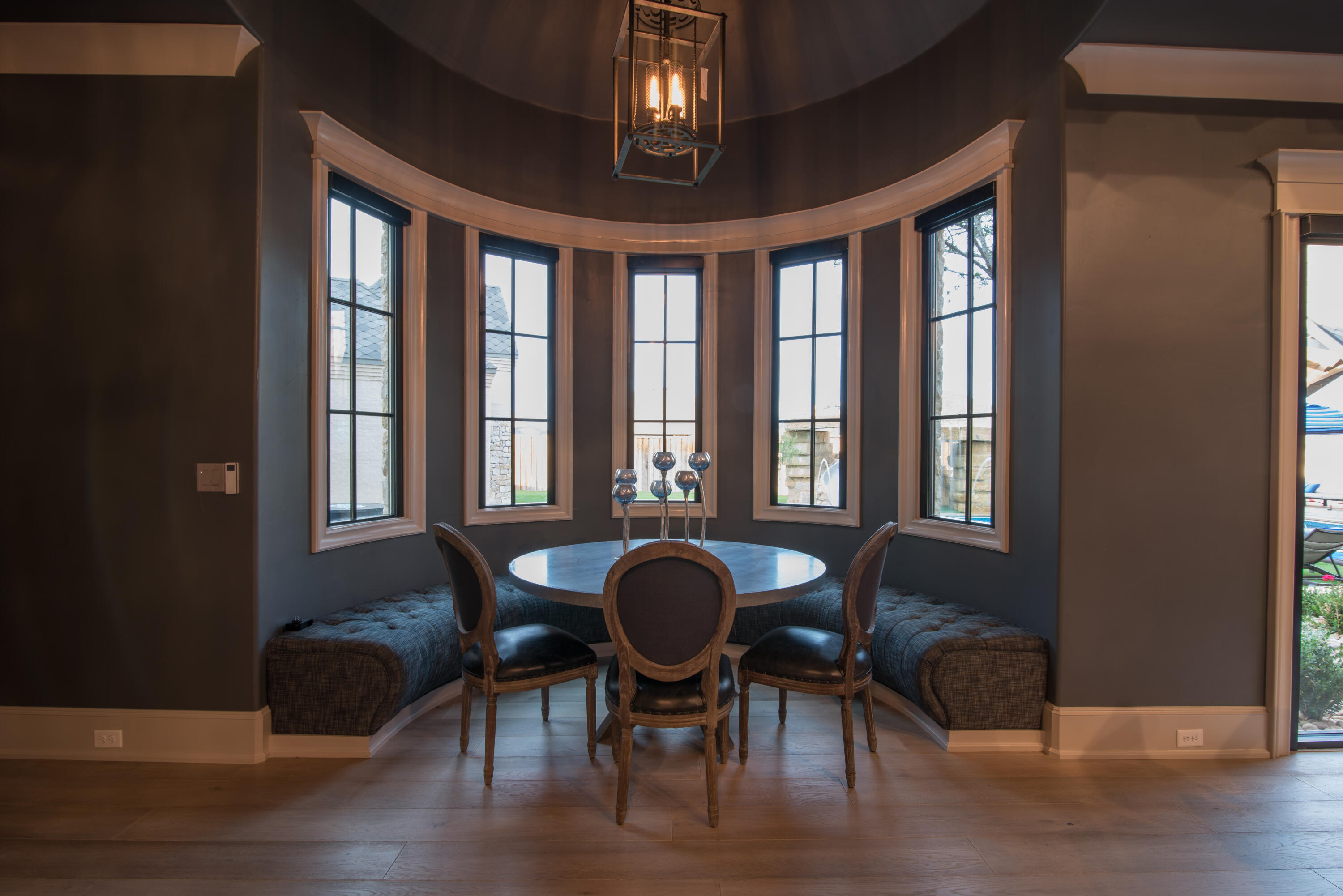 4008 139th Street Lubbock, TX 79423 - Photo 22 of 47 a view of a dining room with furniture wooden floor and chandelier