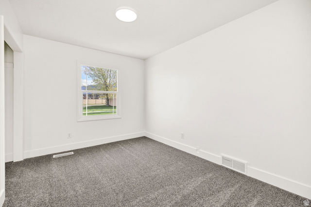 4155 Johnson Road Nibley, UT 84321 - Photo 21 of 71 Unfurnished bedroom with baseboards and dark carpet