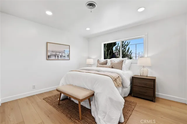 a bedroom with a bed and a bookshelf