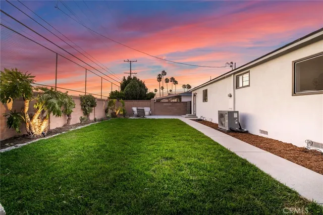 a view of a backyard with potted plants