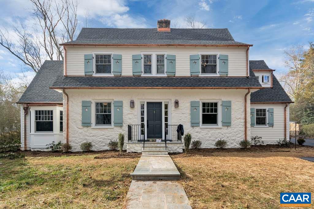 a front view of a house with yard