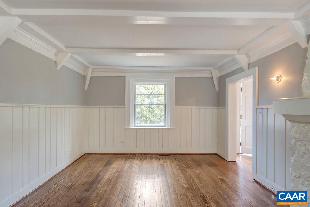 1852 Winston Road Charlottesville, VA 22903 - Photo 4 of 16 a view of an empty room with wooden floor and a window