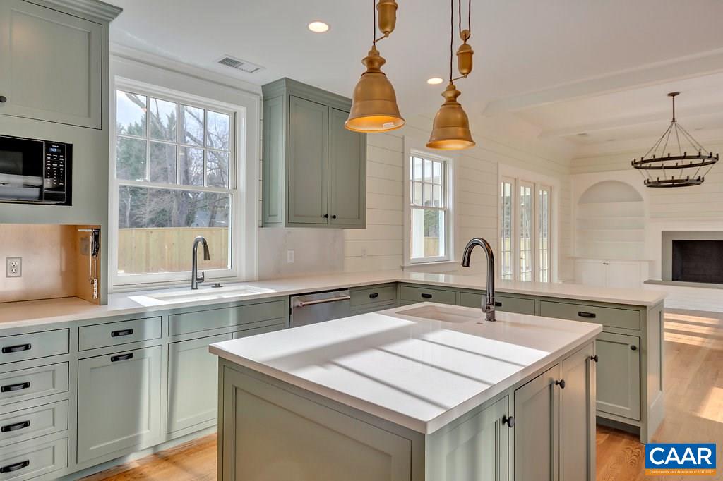 1852 Winston Road Charlottesville, VA 22903 - Photo 9 of 16 a kitchen with a sink a window and cabinets