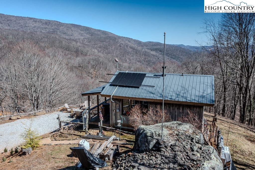Jerry's Creek Road Newland, NC 28657 - Photo 14 of 49 a view of a roof deck with chair and tables