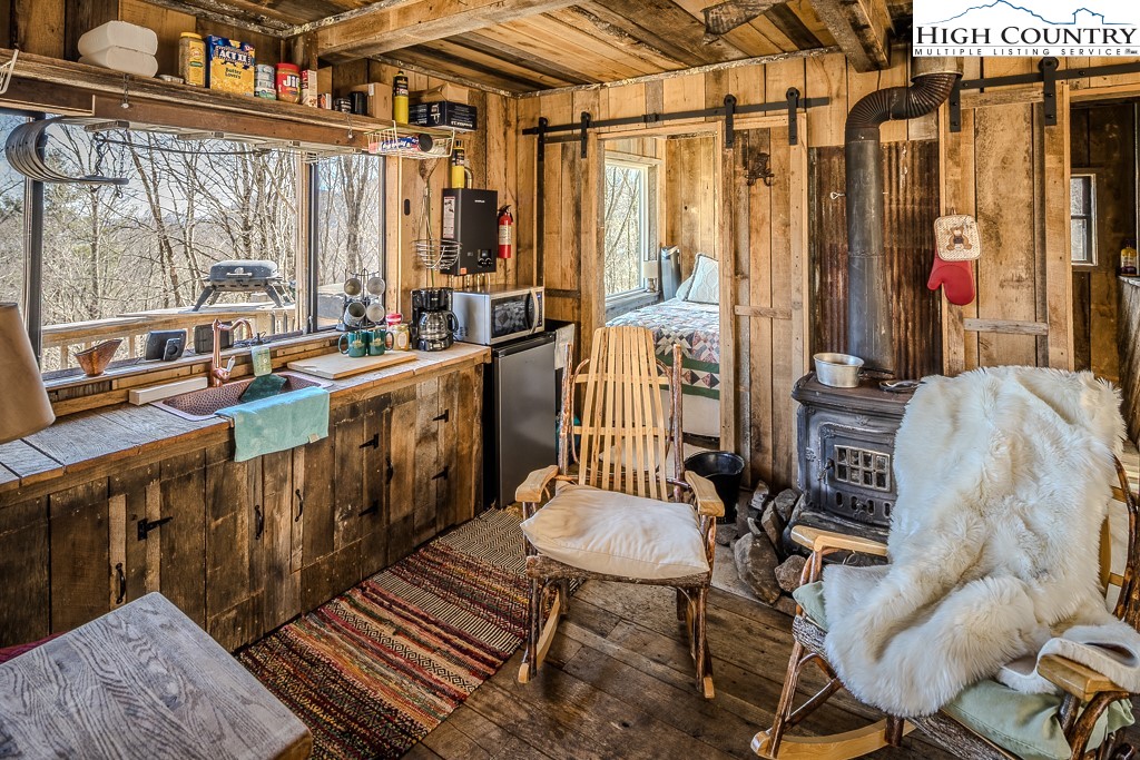 Jerry's Creek Road Newland, NC 28657 - Photo 21 of 49 a view of a chairs and table in a patio