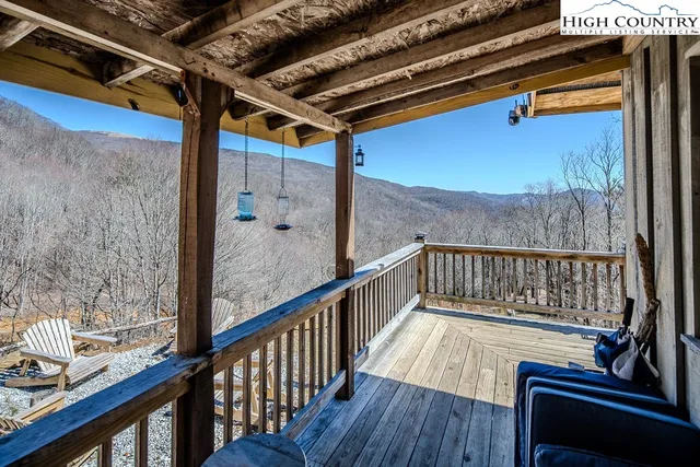 a view of balcony with wooden floor and chair
