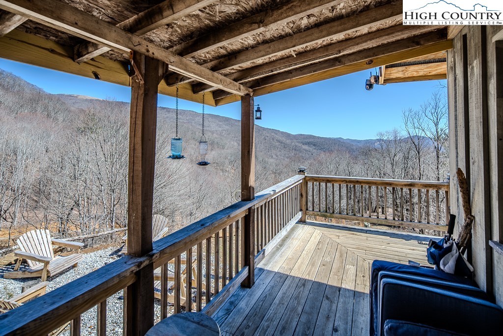 Jerry's Creek Road Newland, NC 28657 - Photo 3 of 49 a view of balcony with wooden floor and chair