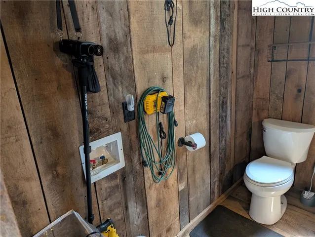 a large bed sitting in a bedroom next to a window