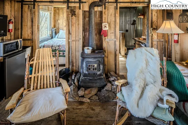 a bedroom with a bed and glass window