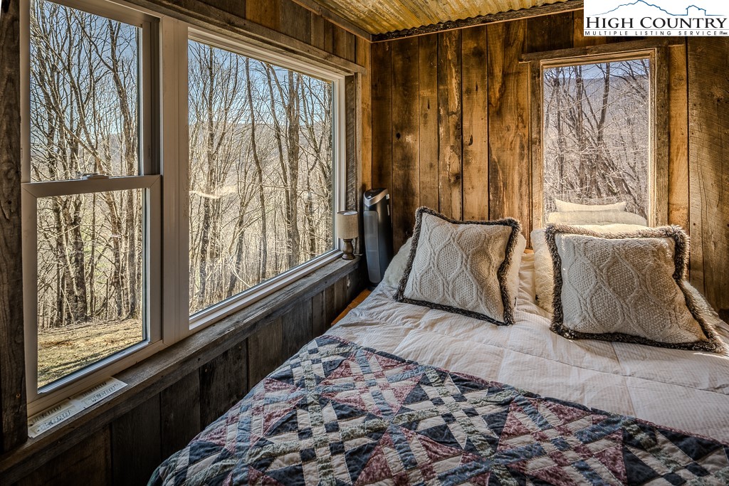 Jerry's Creek Road Newland, NC 28657 - Photo 34 of 49 a bedroom with a bed and glass window