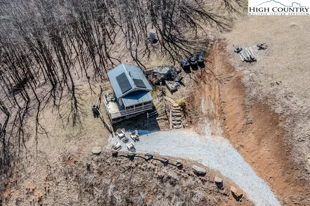 a view of house with backyard space and sitting area