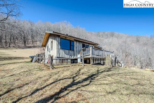 a view of a house with a snow on the road