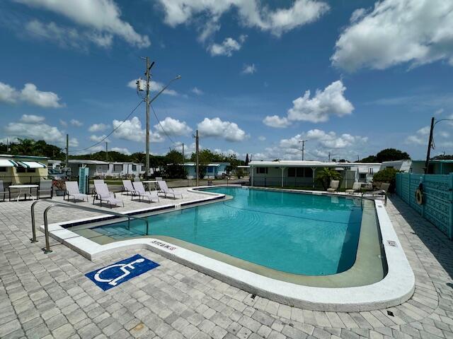 2023 St Lucie Boulevard, Unit 69 Fort Pierce, FL 34946 - Photo 15 of 20 a view of a swimming pool with outdoor seating