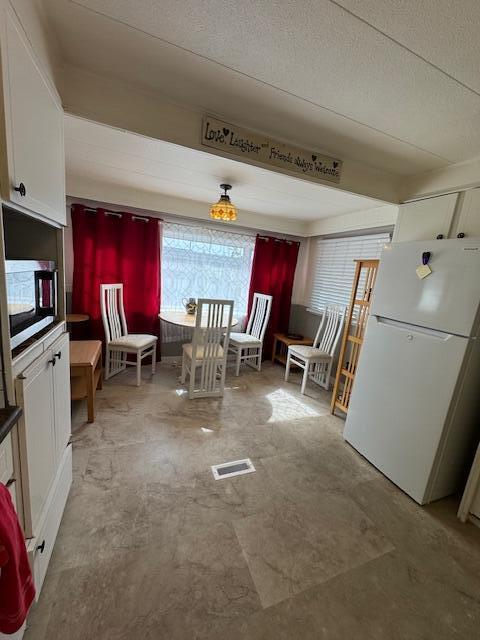 2023 St Lucie Boulevard, Unit 69 Fort Pierce, FL 34946 - Photo 3 of 20 a view of a room with chairs and toys