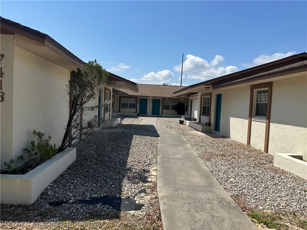 7422 Valencia Road Sebring, FL 33876 - Photo 1 of 15 a view of a house with a patio