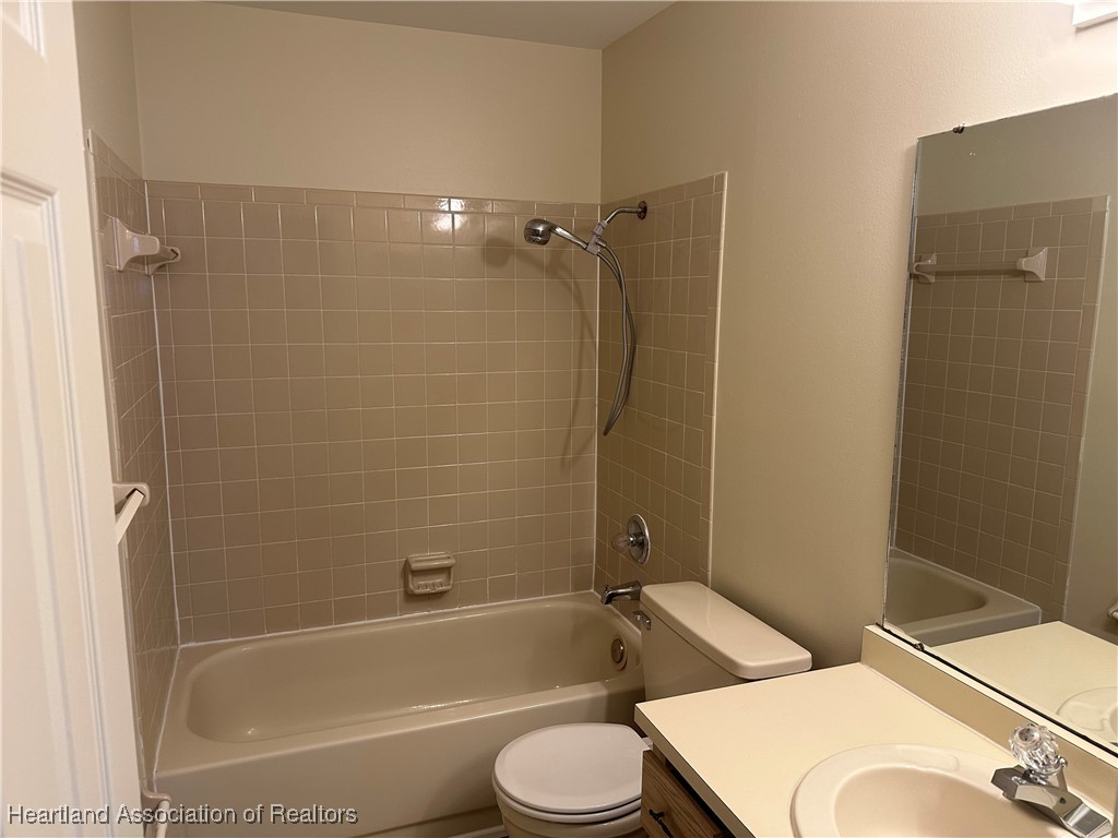7422 Valencia Road Sebring, FL 33876 - Photo 14 of 15 a bathroom with a toilet sink and shower