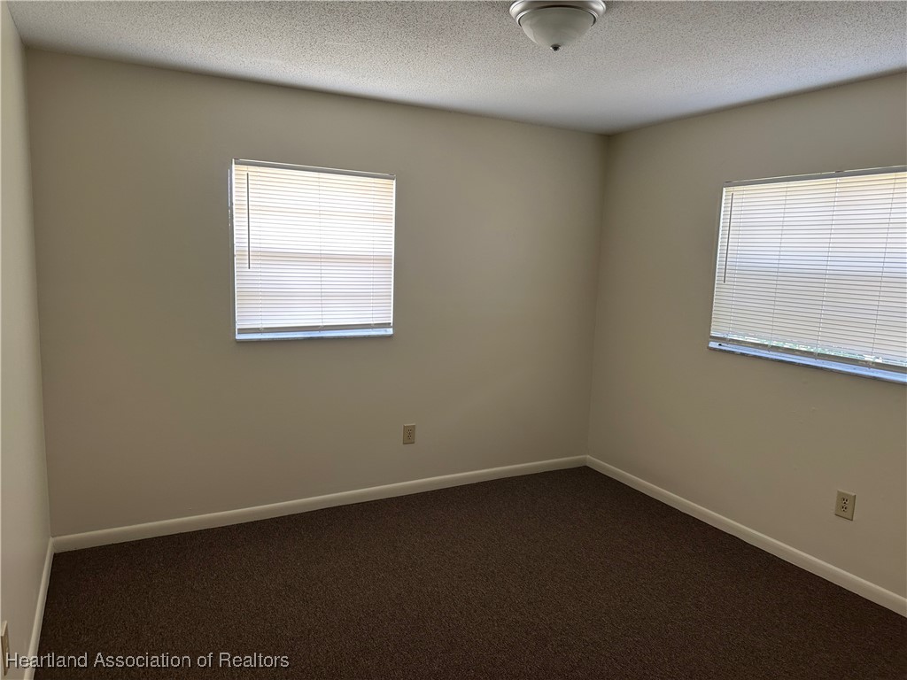 7422 Valencia Road Sebring, FL 33876 - Photo 15 of 15 an empty room with a window